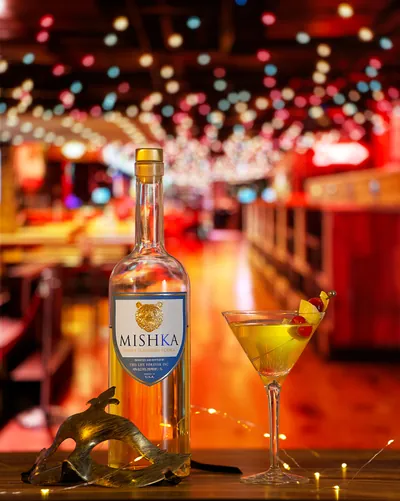 A Mishka Honey cocktail on a bar.